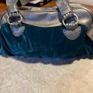 Lou Lou velvet turquoise blue handbag.